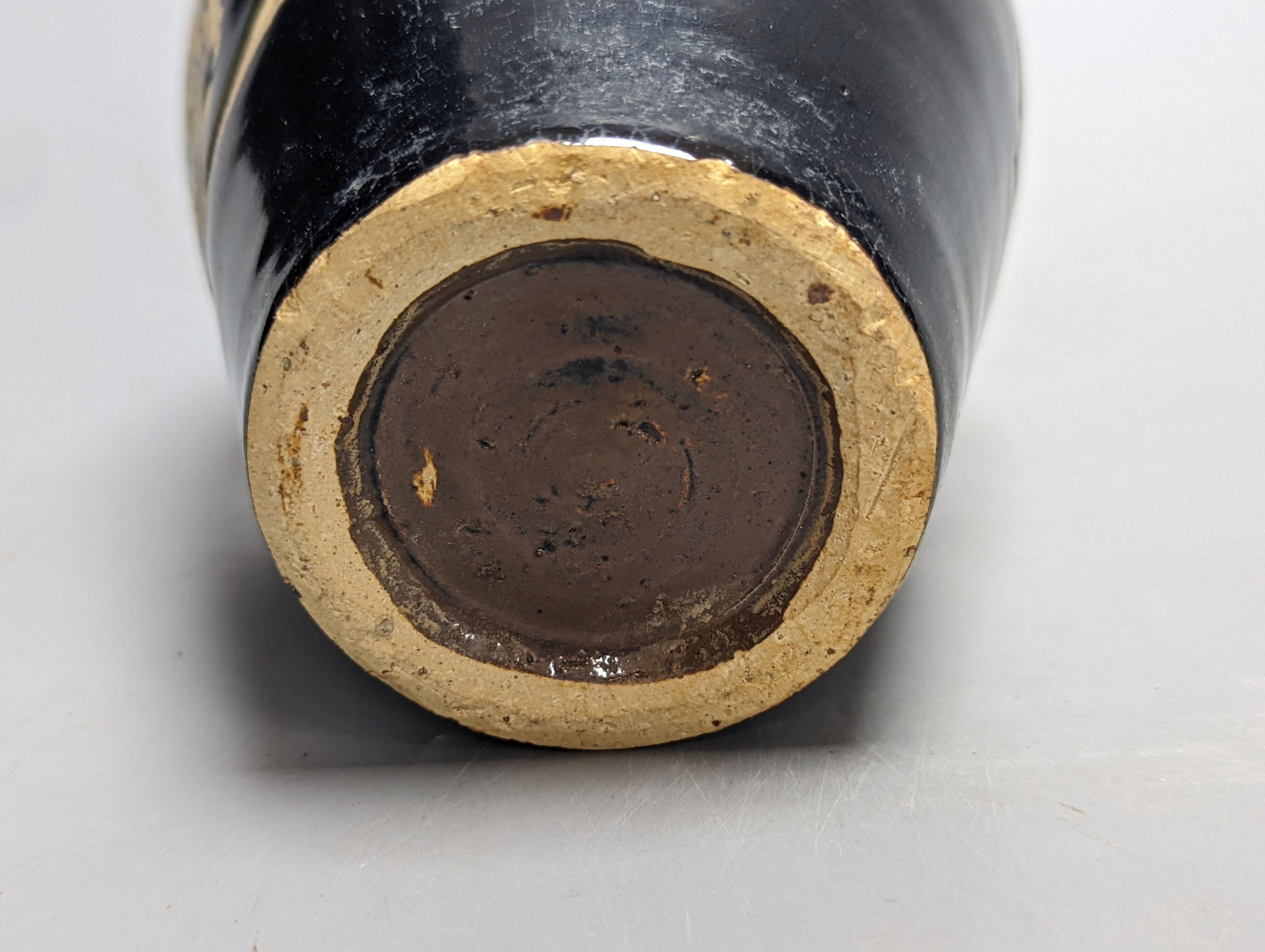 A Chinese oil spot glazed cup with integral stand and a black glazed resist pottery vase, 18cm